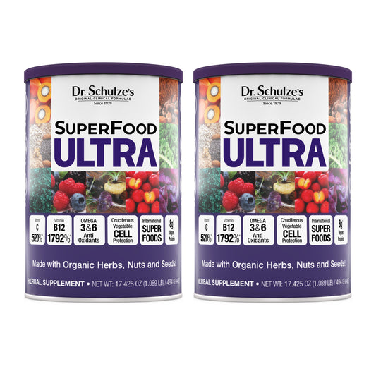 Two cans of Dr. Schulze's SuperFood Ultra on a white background